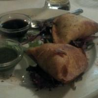 Samosas · Spiced potatoes and peas stuffed in triangular pastry shell. Vegetarian.