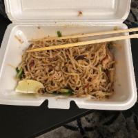 Pad Thai · Thin rice noodle, bean sprout, green onion and crushed peanut on the side.
