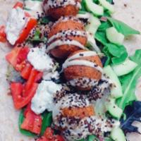 Mediterranean Falafel Wrap · Falafel / Greens / Quinoa / Cucumber / Lemon Tahini / Tzatziki 
