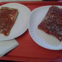Grandma Slice · Thin, square deep-dish pizza slice with tomato sauce, deli-sliced mozzarella, fresh basil, a...