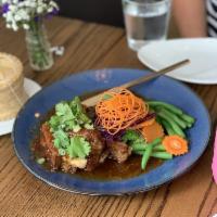 Baby Back Ribs · Tamarind sauce served with steamed mixed vegetables and sticky rice. Spicy.