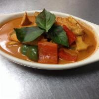 Red Curry · Red curry paste, coconut milk, bamboo shoots, bell peppers, eggplant and basil leaves. (spicy)