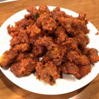 Chicken 65 · Boneless chunks of chicken marinated in ginger garlic mild spices, butter fried and tempered...