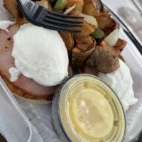 Traditional Eggs Benedict Platter · A toasted English muffin topped with Canadian bacon, poached eggs and hollandaise sauce with...