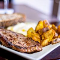 Steak and Eggs Platter · A tender cut of beef cooked to order with 2 eggs anyway and a side of home fries.