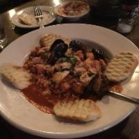 Tuscan Stew · Seafood stew with shrimp, tilapia, calamari, crab, clams, mussels, scallops, in a lightly sp...