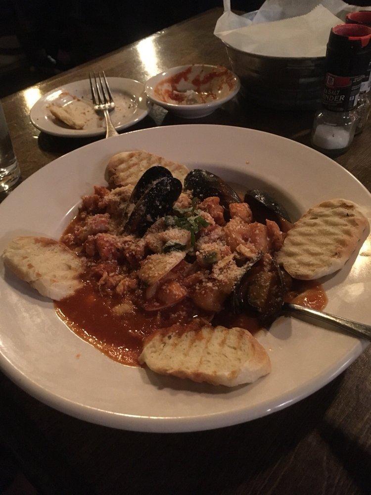 Tuscan Stew · Seafood stew with shrimp, tilapia, calamari, crab, clams, mussels, scallops, in a lightly spicy tomato sauce served with grilled homemade bread.