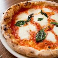 Margherita Pizza · Tomato sauce, fior di latte mozzarella, basil and extra virgin olive oil.