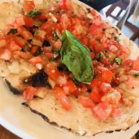 Bruschetta · Housemade bread fresh from our wood burning oven topped with cherry tomatoes, fresh basil an...