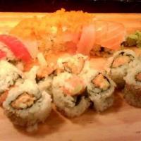 Rainbow Roll · Inside crab, cucumber and avocado. Outside 5 kind of different fish and masago.