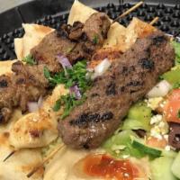 Mixed Grill Platter · Chicken, beef and kafta served with homemade hot pita, Greek salad and rice.