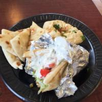 Chicken Gyro · Served with lettuce, tomato and hummus.