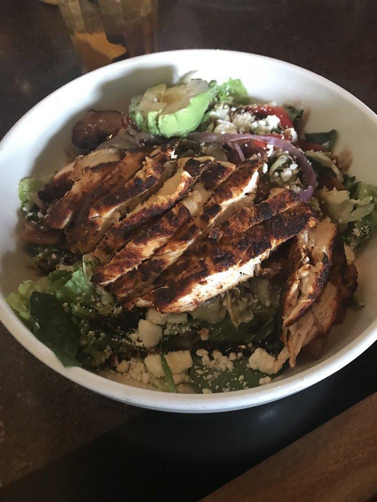 Blackened Chicken Bowl · Spanish rice, cabbage, black beans, smoked Anaheim peppers, shredded pepper jack, pico de gallo, guacamole, pickled red onions, sour cream and red bell peppers, finished with chopped cilantro. Substitute blackened steelhead fillet, ahi tuna or steak for blackened chicken for an additional charge.