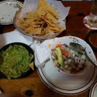 Ceviche · Lime cooked tender fresh fish, pico de gallo, avocado and chips.