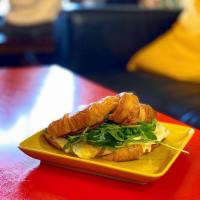 Croissant Sandwich · Boar’s Head turkey and provolone cheese, egg, avocado slices, heirloom tomato, and arugula.