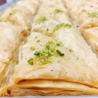 Baklava · Delicate layers of filo pastry filled with walnuts and pistachios moistened with a light sug...