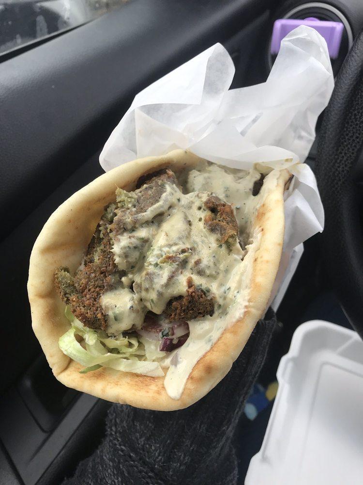Falafel Gyro Wrap · Deep-fried balls with tahini sauce. Served with lettuce, tomatoes, onions, and pickles. Add hummus for an additional charge.