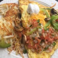 Southwestern Omelette · 3 egg omelet with tomatoes, onions, green peppers, jalapenos, mushrooms, sour cream , pico d...