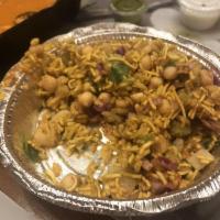 Bhel Poori · Tangy mixture of pulled rice with potatoes, onions, cilantro, green chilies tossed with tama...