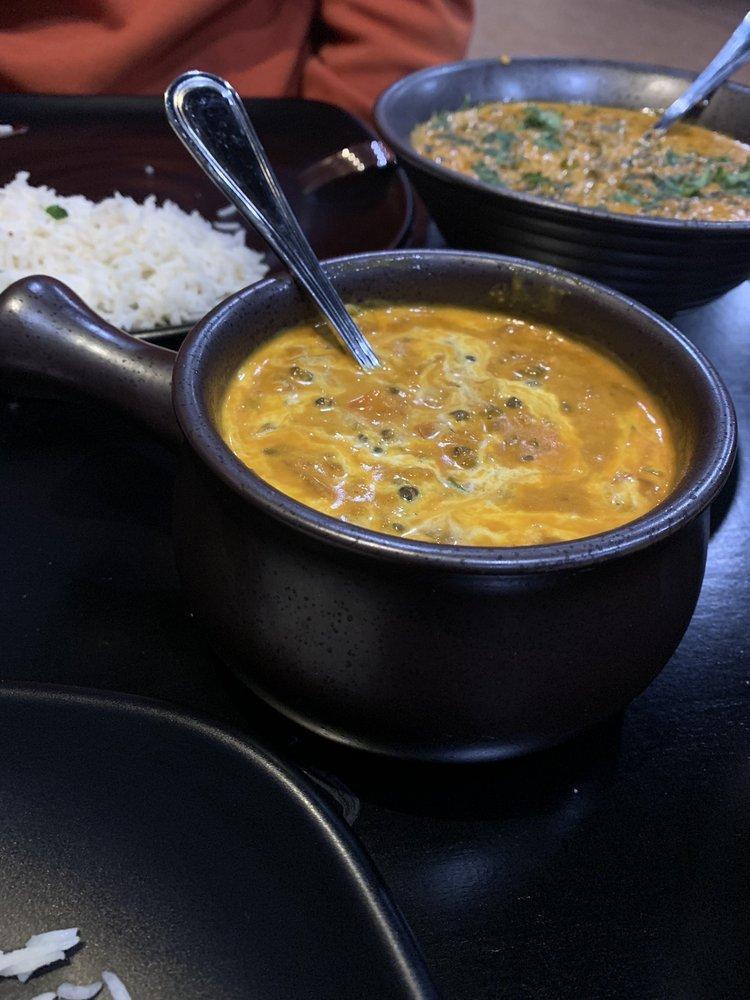Dal Makhani · Black lentils cooked with fresh tomatoes and garlic, simmered overnight and topped with cream and butter.