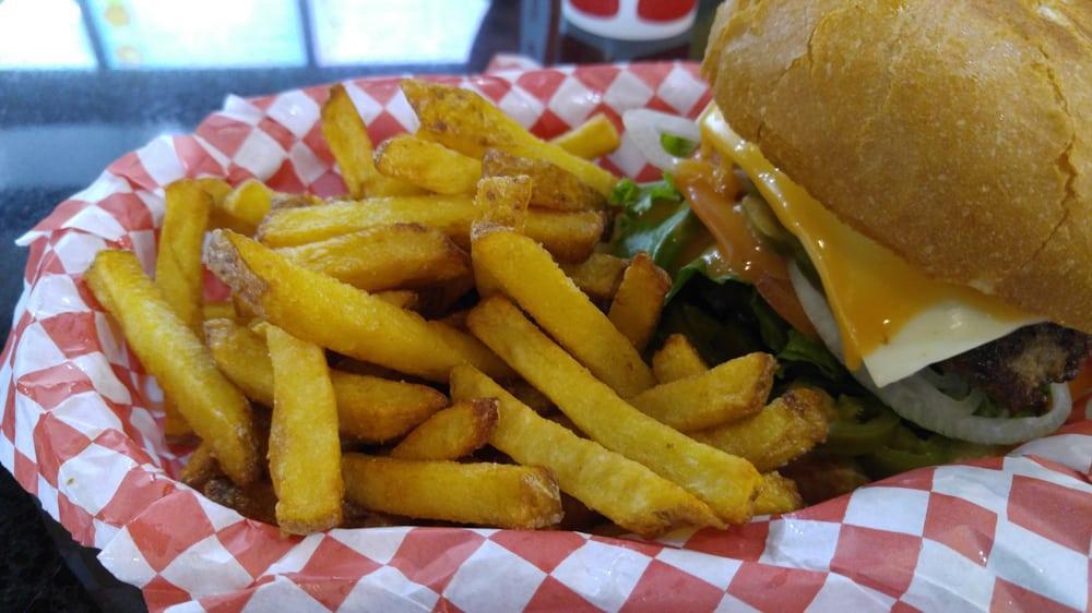 Texas Burger · Onion, pickles, lettuce, tomato, Swiss cheese, jalapeno peppers, mayo and house sauce. Served spicy.
