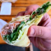 Smoked Salmon Wrap · Salmon with dill sour cream, greens, pickled shallots, and lemon, wrapped in our famous pota...