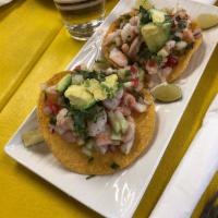 Ceviche · Raw or undercooked. Cooked shrimp marinated in lime juice, onion, cilantro, tomato, avocado,...