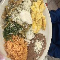 Chilaquiles Verdes · Fried tortillas in green sauce (Onions, cilantro, sour cream, cheese, rice and beans).
