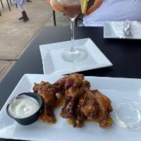 West Scotch Bonnet Wings · Includes wings marinated in a signature scotch bonnet sauce served with ranch dressing.
