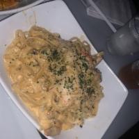 West Signature Pasta · Includes creamy jerk pasta blended with a colorful assortment of bell peppers served with gr...