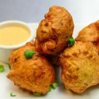 Conch Fritters · Include tender conch chopped and seasoned with herbs and spices, mixed in a rich batter and ...