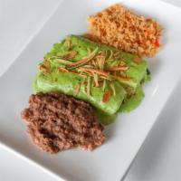 Spinach Enchiladas · 2 corn tortillas rolled with sauteed spinach and topped with mozzarella cheese, cream leek s...