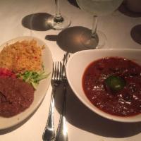 Carne Guisada · Tex-Mex stew with beef tenderloin tips slow simmered and served in a thick gravy sauce. Serv...