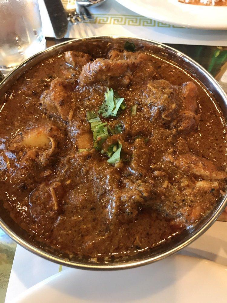 Chicken Vindaloo · A fiery, vinegar flavored chicken and potatoes preparation. A goan dish. Boneless and served with basmati rice. Spicy.