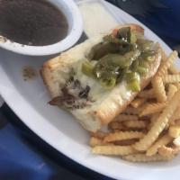 Italian Beef Sandwich · Shredded roast beef marinated in au jus on a French roll. Served with a side of au jus. Incl...