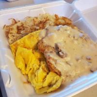 Country Fried Steak and Eggs · Our famous country fried steak topped with sausage gravy and served with two eggs any style ...