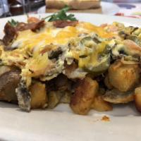 Spicy California Skillet · Our home-style potatoes topped with bacon, mushrooms, tomatoes, jalapeños, scrambled eggs an...