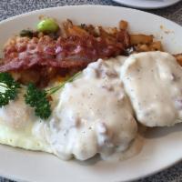 Combo Breakfast · Our homemade biscuit topped with our delicious sausage gravy, served with two eggs* any styl...