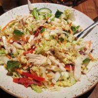 Thai Chicken Salad · Hand-shredded chicken breast, chopped napa cabbage, mint, cilantro, carrots, red bell pepper...