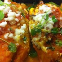Pollo Toloache · Chipotle-marinated chicken breast a la plancha, crispy Mexican cheeses-pinto bean dumpling, ...