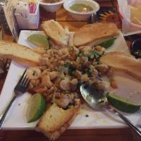 Mariscos Mixtos · Fresh fish, shrimp, crawfish, onions, cilantro, tomatoes and calamares.
