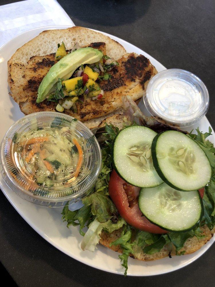 Blackened Fish Sandwich · Whitefish, greens, tomato, cucumber, avocado, mango salsa, garlic lime aioli. Add salmon for an additional charge.