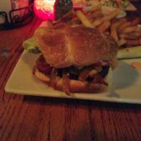 Kona Burger · 100% natural, 1/3 hand-formed ground Angus chuck topped with 2 slices of bacon. Served with ...