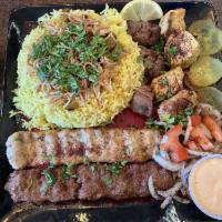 Mixed Grill · 4 skewers: lamb tikka, chicken tikka, chicken kabobs and mixedimeat kabobs with rice, salad ...