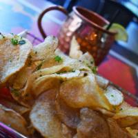Piggy Chips · crispy bacon-fried potato chips served with white bbq sauce