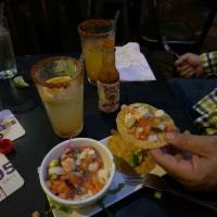 Ceviche · Fish or shrimp ceviche mixed with pico de gallo and cucumbers. Topped with lime onions, dice...
