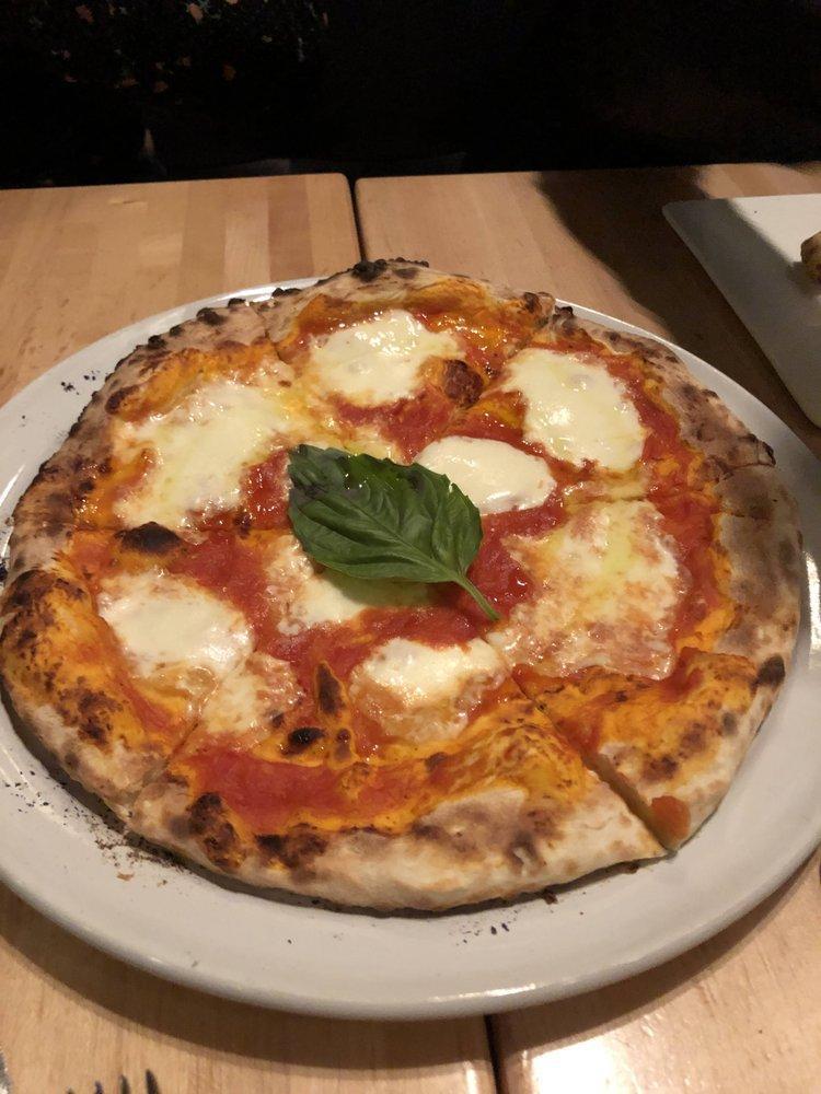 Margherita Pizza · Tomato, fresh mozzarella, basil, extra virgin.