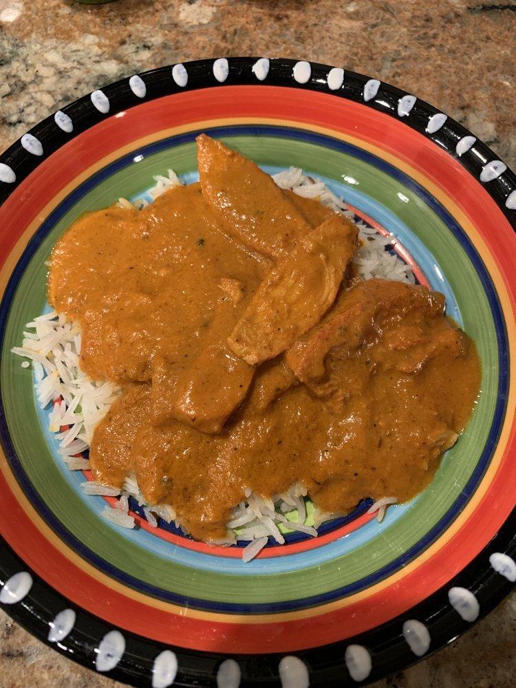 Butter Chicken · Boneless chicken cooked in onion and tomato gravy with Himalayan spices.