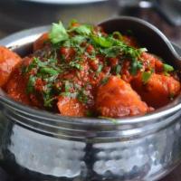 Chicken Vindaloo · Boneless chicken breast cooked in special gravy sauce with herbs and spices.
