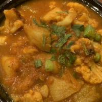 Aloo Gobi Curry · Potatoes and cauliflower with onion and tomato sauce with Himalayan spices.